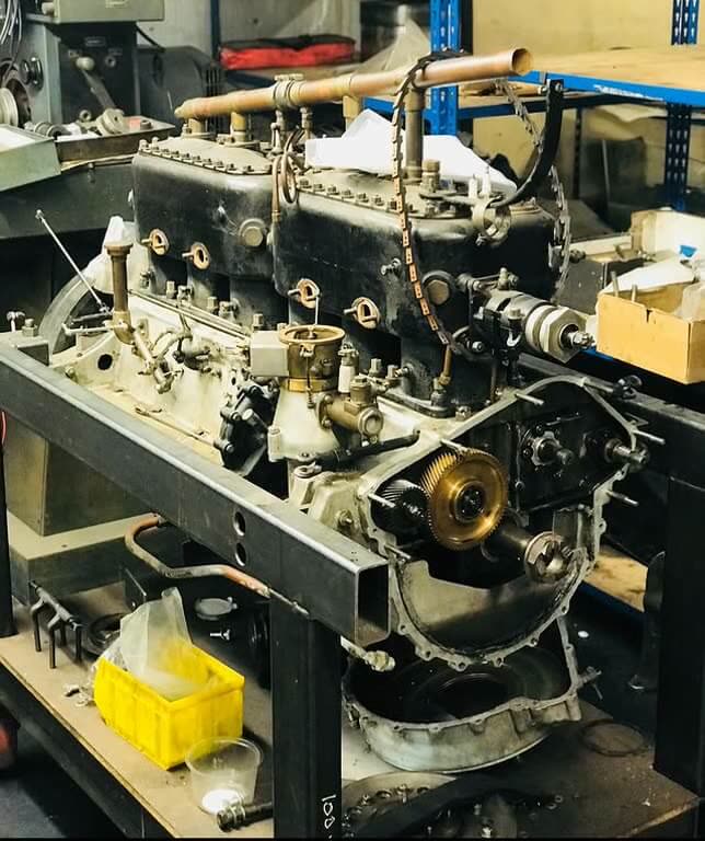 Classic inline-six engine on the bench mid-rebuild
